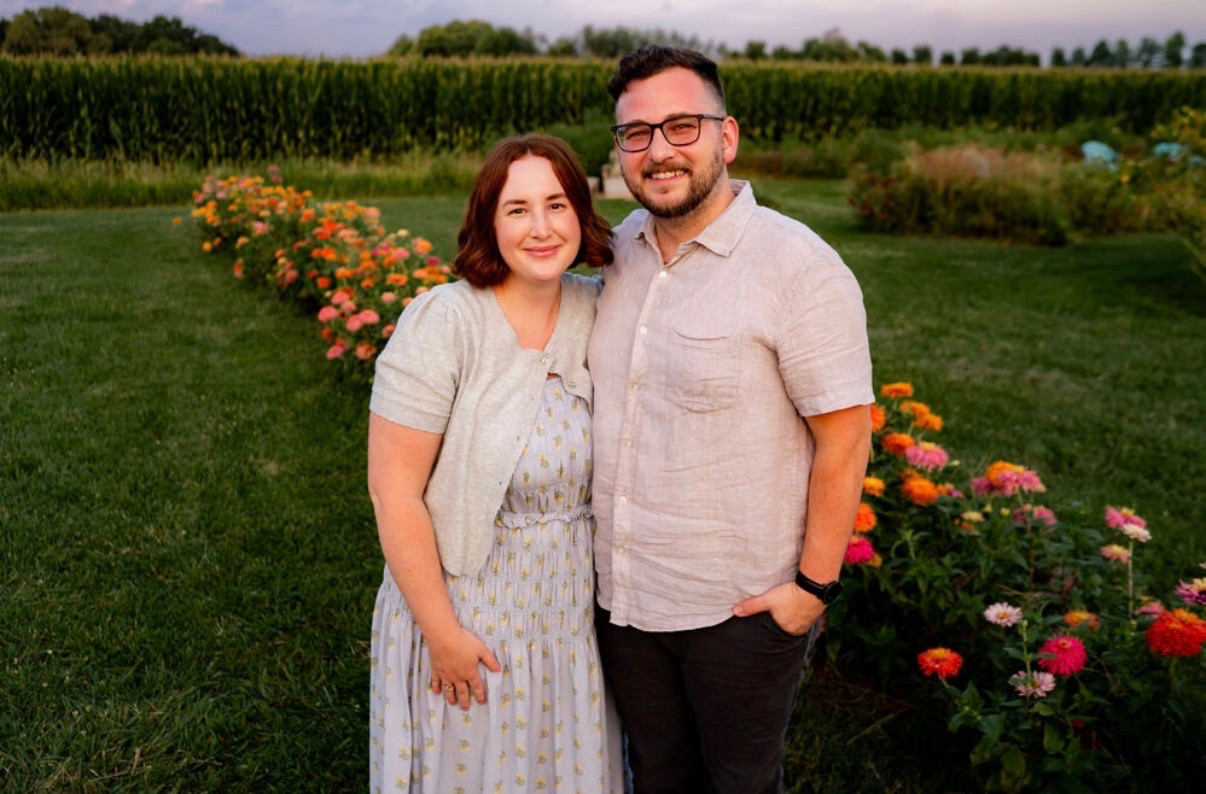 Nick and his wife together in a flower garden
