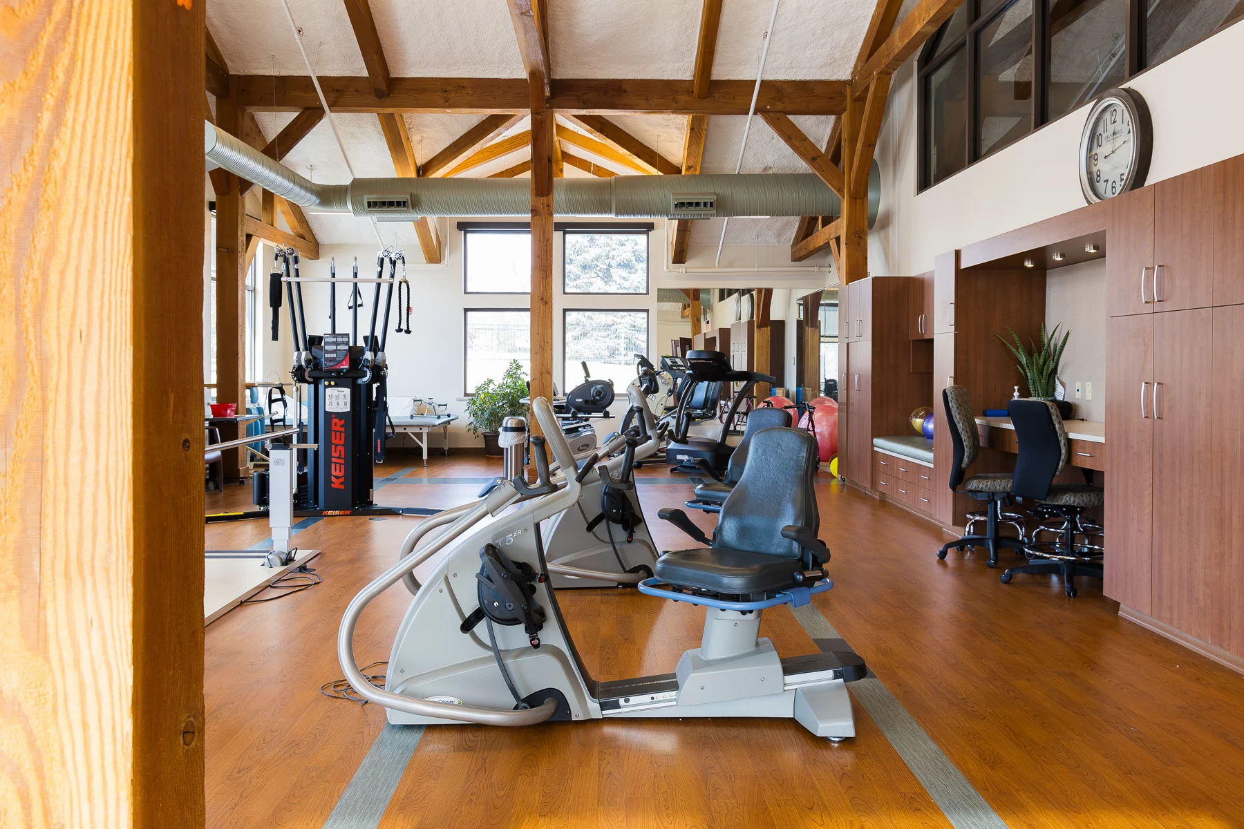 The Villas rehabilitation gym beneath exposed timber beams